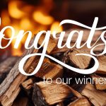 Stacked firewood in front of a glowing flame background with the words “Congrats! to our winners!” written in bold white script.