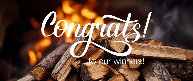 Stacked firewood in front of a glowing flame background with the words “Congrats! to our winners!” written in bold white script.